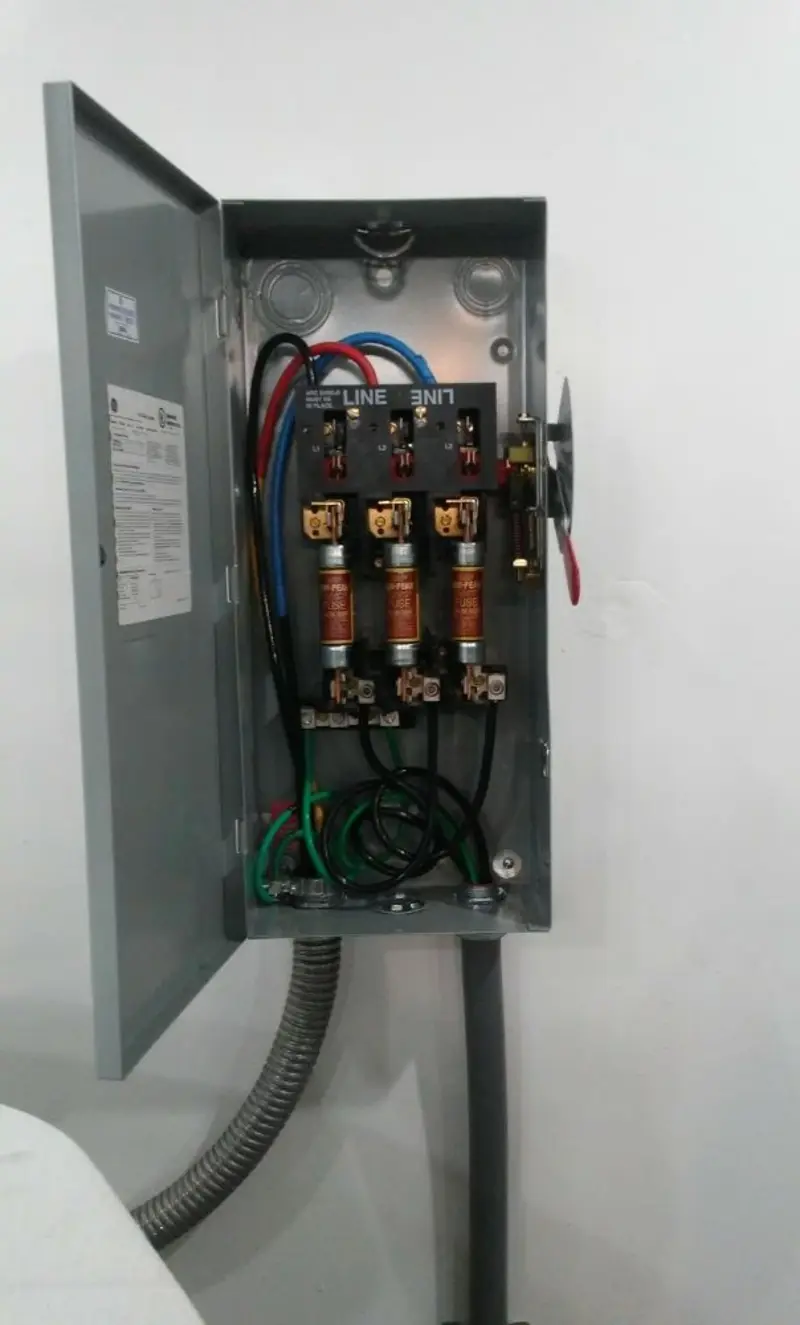 Three-phase disconnect switch installed for Smoke Detector Installation in Evans